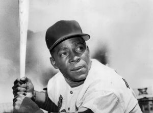 Minnie Minoso with bat.